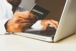 Person Using Card to Purchase Something Online